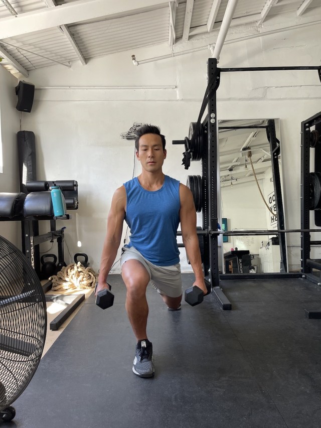 tim liu doing a dumbbell split squat