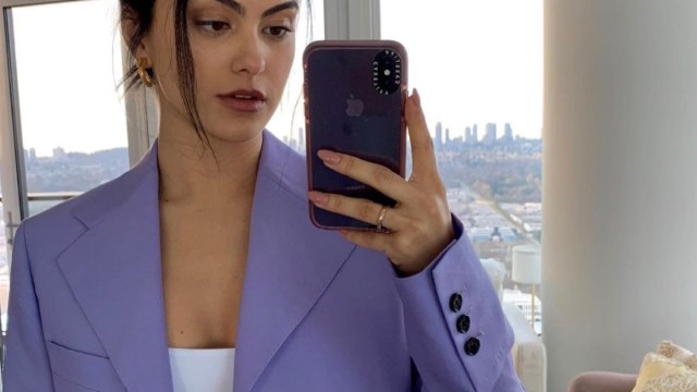 camila mendes taking selfie in purple jacket