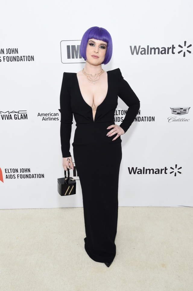 kelly osbourne with purple bob in black dress