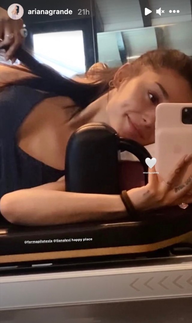 ariana grande on pilates reformer taking selfie