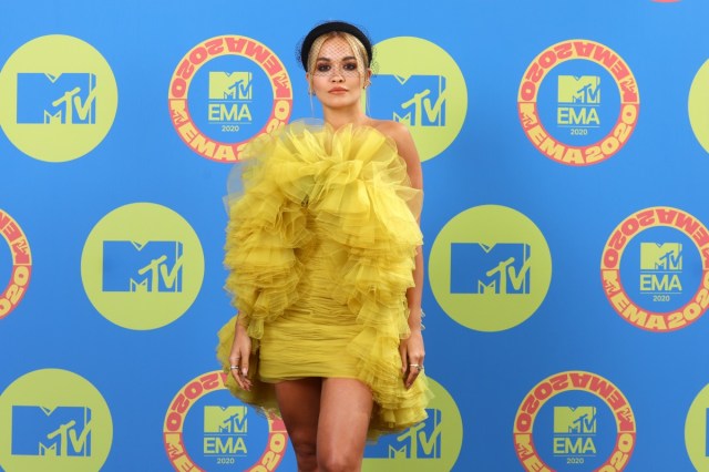 rita ora in yellow ruffled dress on red carpet