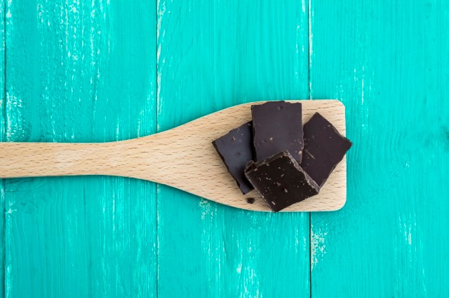 Dark chocolate on a turquoise colored table