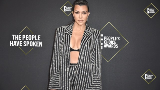 kourtney kardashian in black and silver striped suit