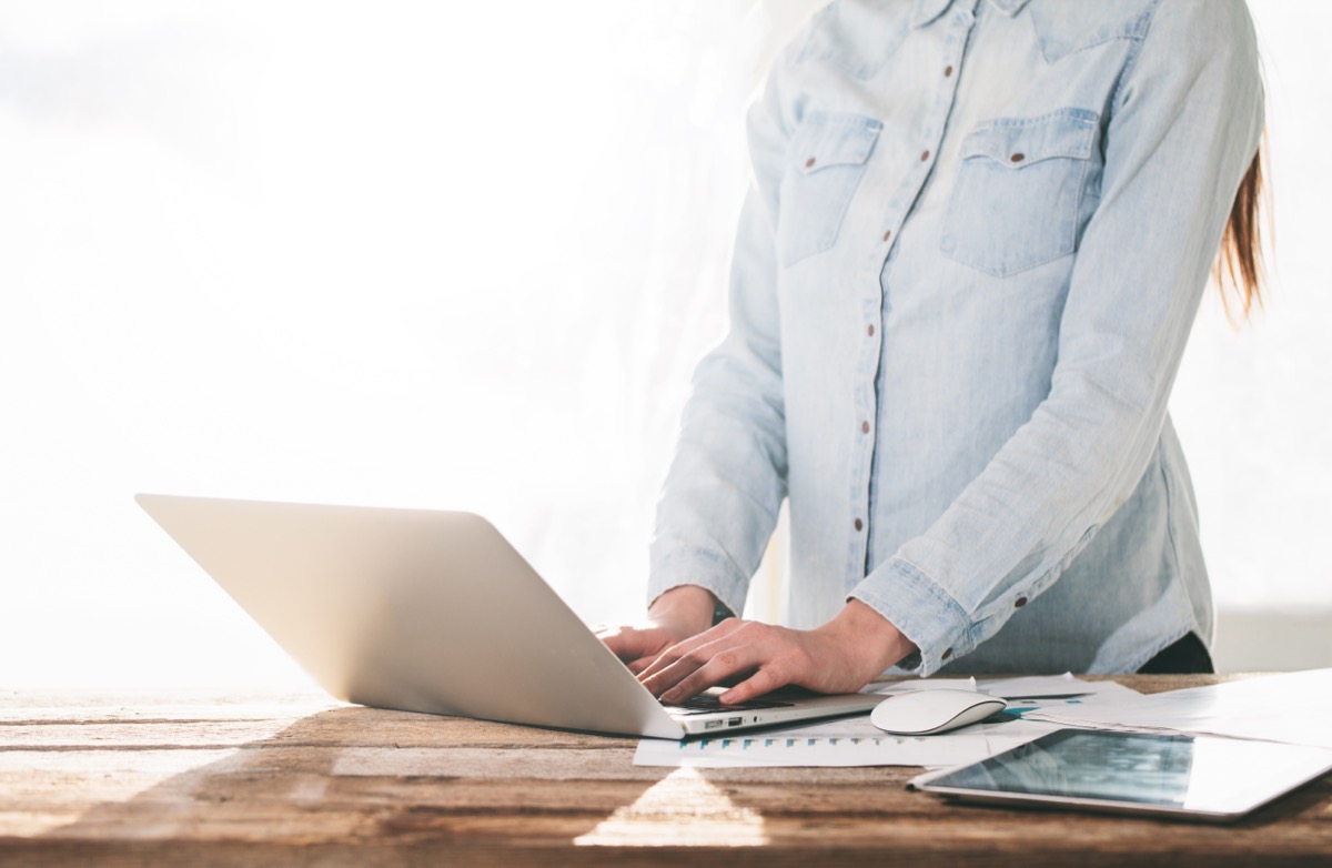 woman using standing desk