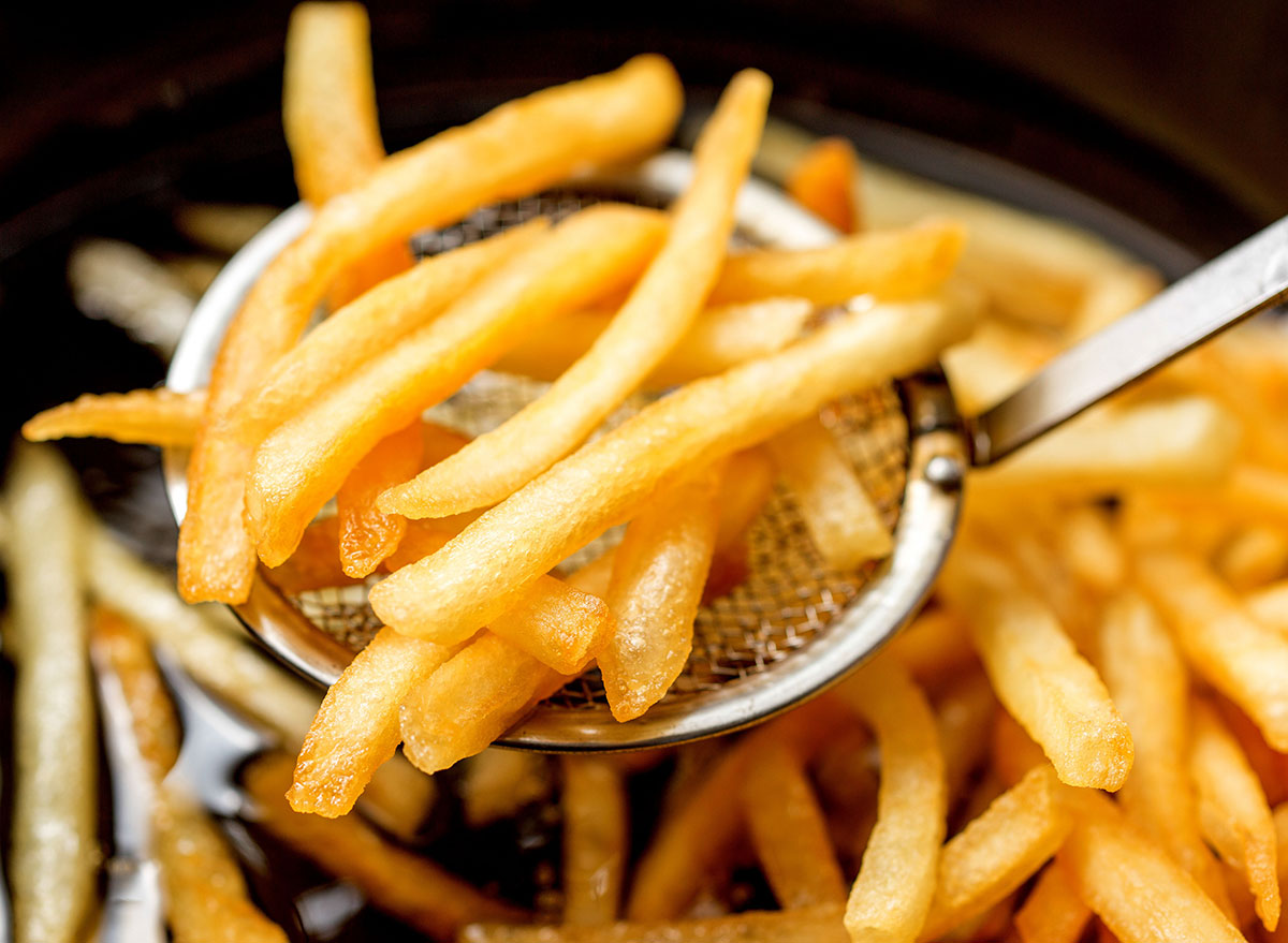 fast food fries coming out of fryer