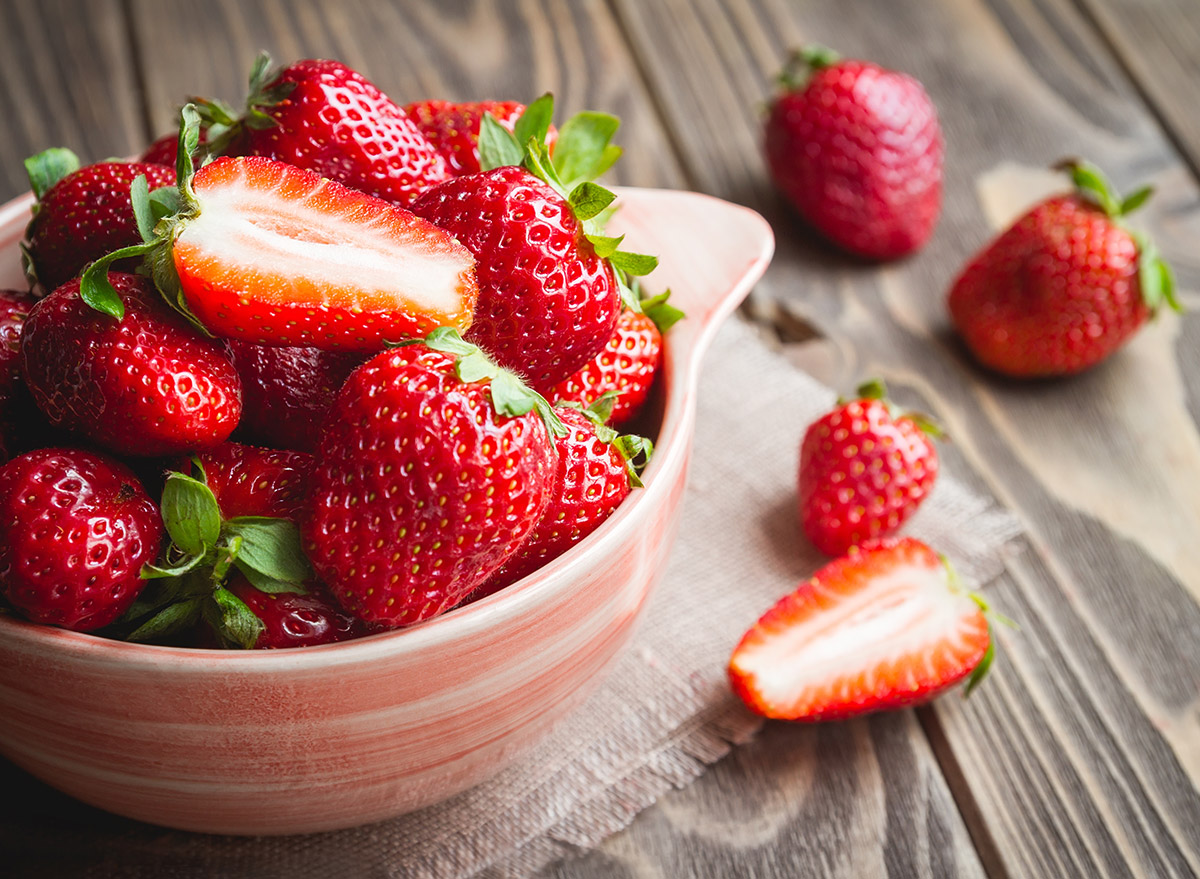 strawberries cut in half in a bowl