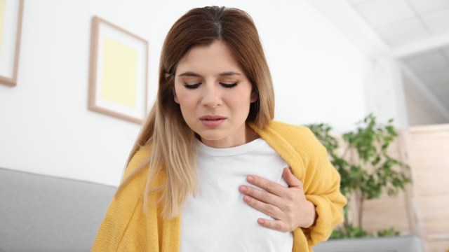 Woman having heart attack at home