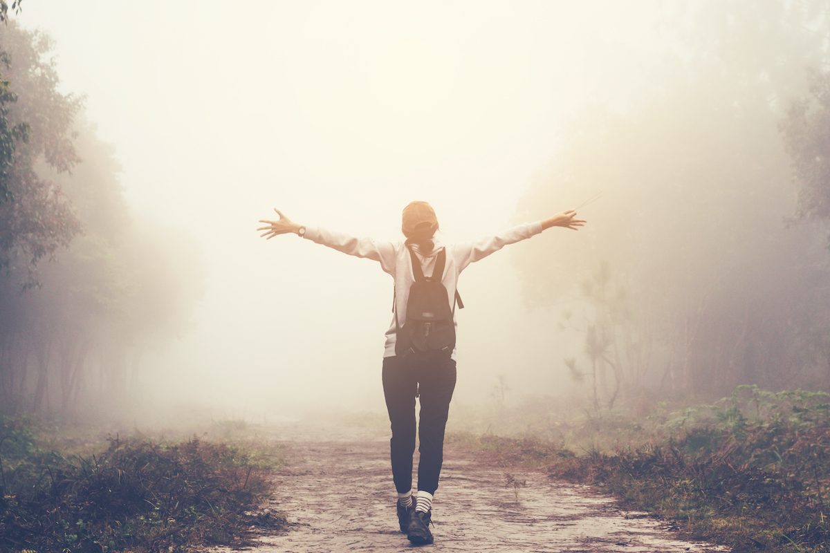 woman walking in a forest