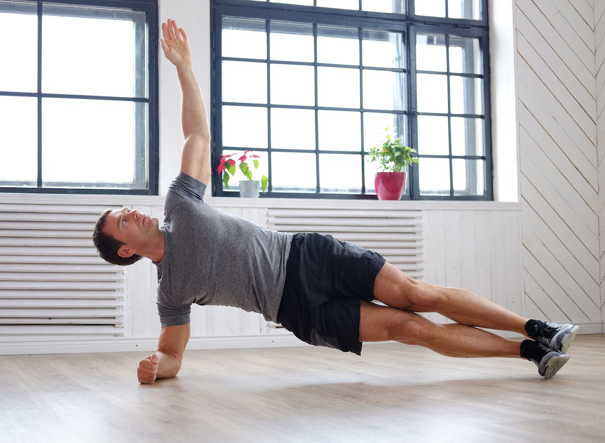 man-doing-side-planks-at-home