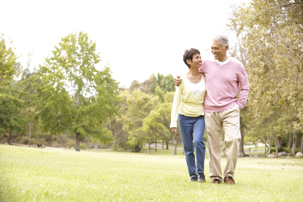 older couple walking outdoors