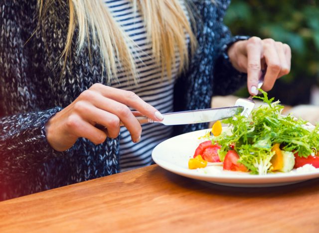 woman eating salad