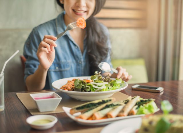 woman eating salad