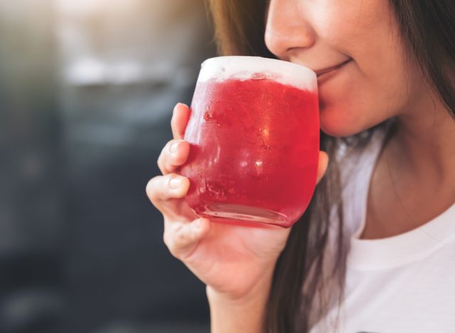 woman drinking sugary beverage