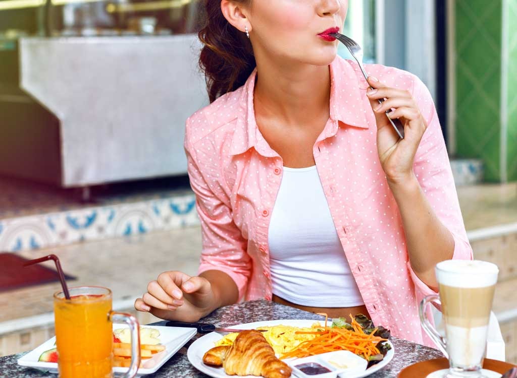 Woman eating breakfast