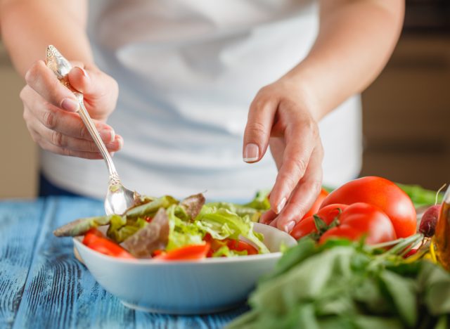 woman preparing salad