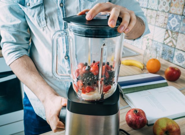 man making smoothie