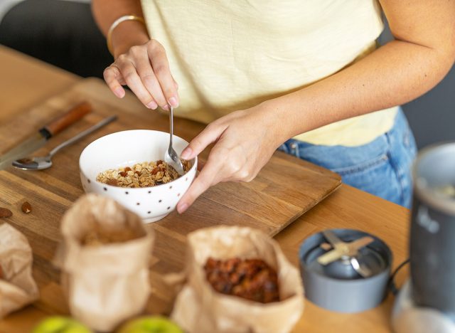 woman mixing up bowl of oatmeal