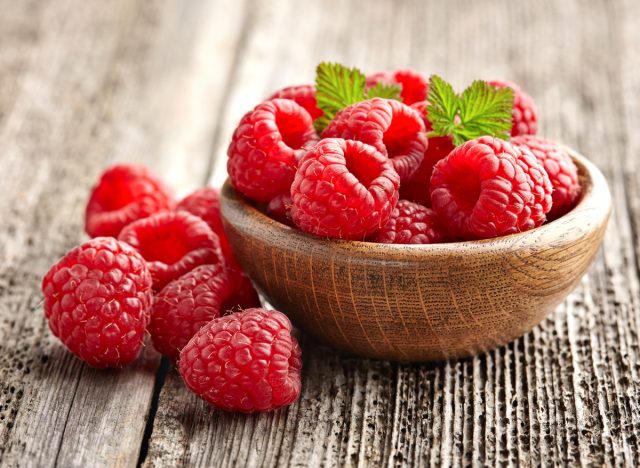 wooden bowl of raspberries